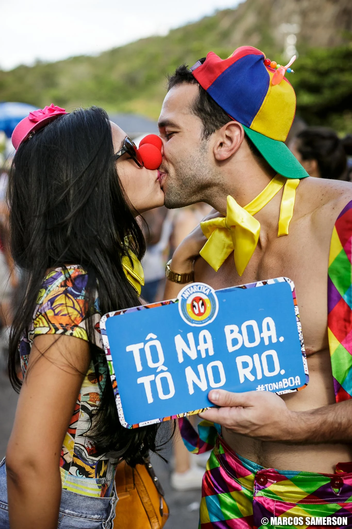 Couple kissing in Carnival costumes during an Antarctica brand activation in Leme, Rio de Janeiro.