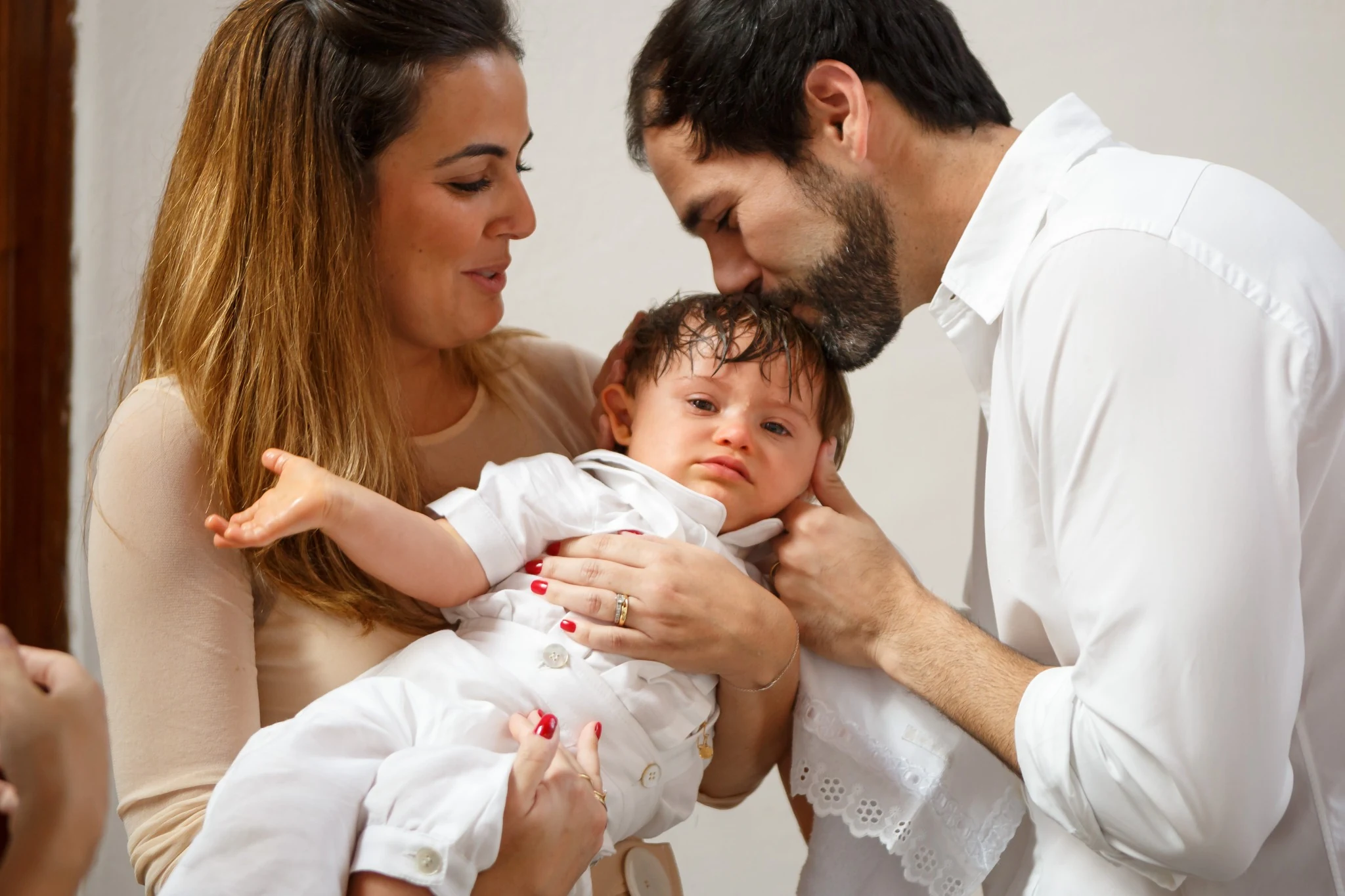 Family during a baptism and birthday celebration.