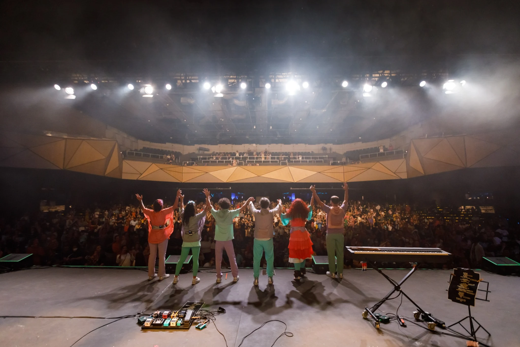 Musicians performing live on stage.