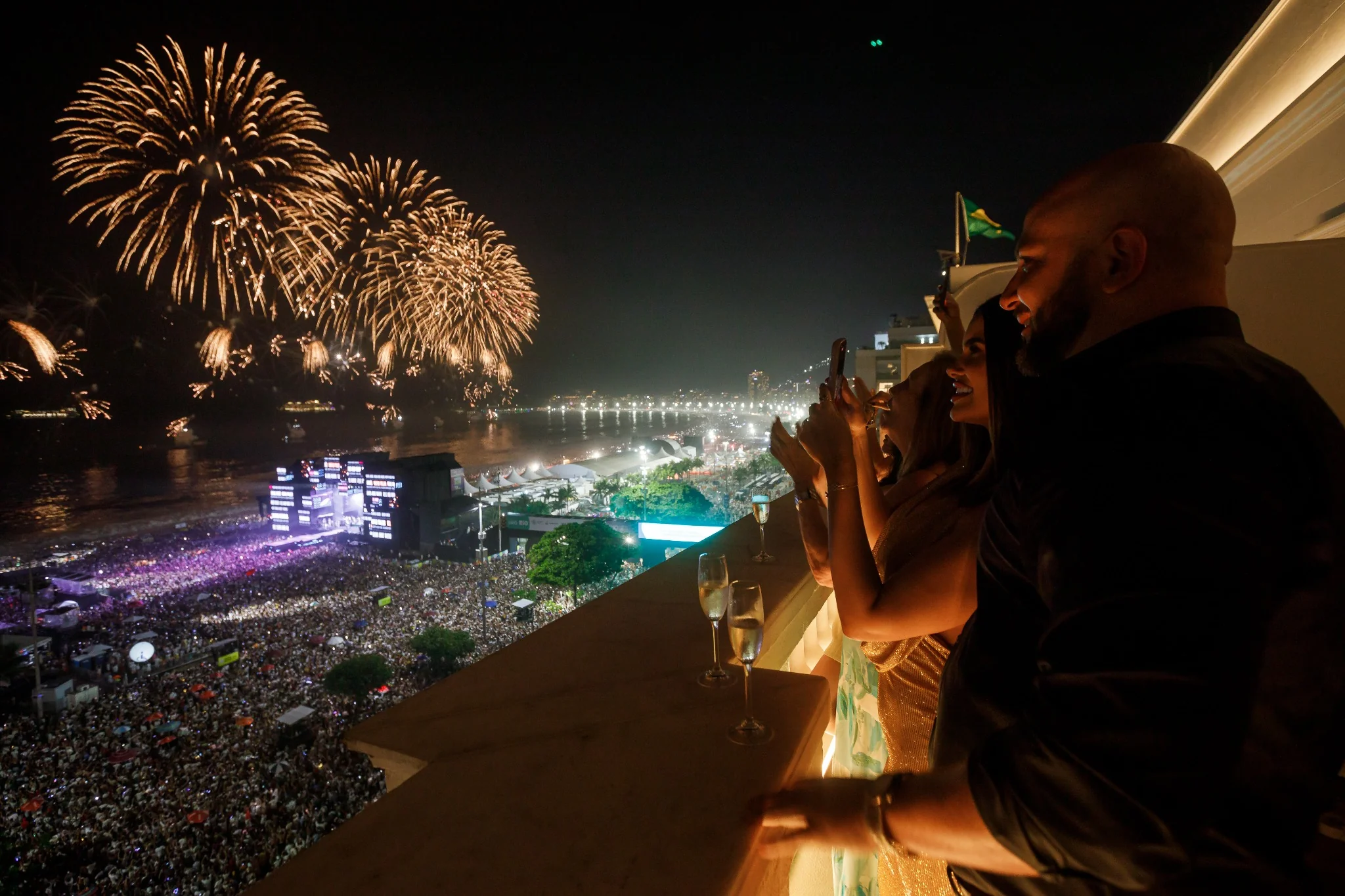 Marcus and Maitê watching the New Year fireworks from Copacabana Palace.