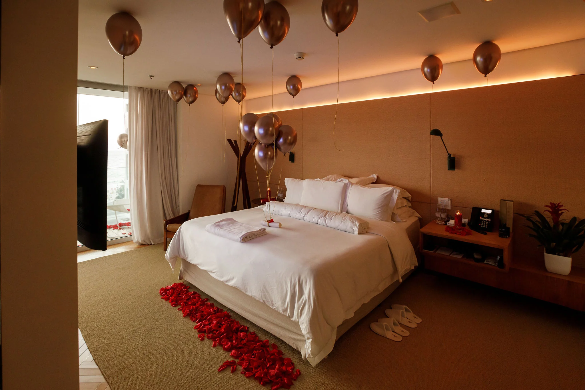 Rose petals and balloons prepared for a surprise proposal in Rio de Janeiro.